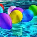 Purple Yellow and Blue Balloon on Swimming Pool