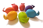 SAVE THE WHALES! "piggy" bank : Available in seven bright, rainbow hued colors, the whale bank is made of porcelain and coated with a soft matte rubber surface finish. Color choices are green, blue, purple, pink, red, orange and yellow matte.A p