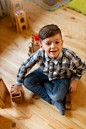 Young boy playing indoors with eco toys