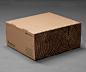 爱这个包装概念和纸箱的讽刺作出看起来像木头疙瘩。
