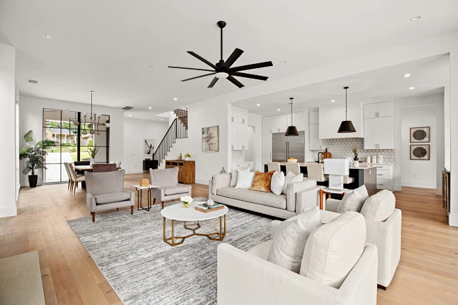 Inspiration for a contemporary open concept light wood floor and beige ...