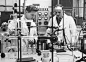 Researchers performing experiment in a laboratory, University of Manchester, England