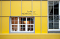 Kafé Nordic咖啡厅 Yellow house-shaped facade fronts cafe by Nordic Bros. Design Community | 灵感日报