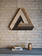 Handmade Penrose triangle made out of reclaimed lath wood. This wood is salvaged from the ceiling of my art studio and has been reimagined into: