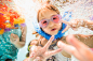 Caucasian children swimming underwater in swimming pool by Gable Denims on 500px