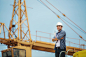 View of a Worker and architect watching some details on a constr by Pramote Polyamate on 500px