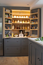 Sustainable Kitchens - A beautiful open plan barn conversion. An open LED lit larder cupboard with amble storage and efficient ventilation painted in Farrow & Ball moles breath. The bottom shelf is a cold shelf with built in wall ventilation with the 