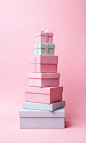 A-stack-of-pink-gift-boxes-with-clouds-in-a-pastel (2)