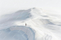 Digital image of minimalistic aerial photography of the desert a small person standing on top of a