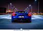Dubai, United Arab Emirates - 06/14/2019: Rear view of Ferrari 488 Spider convertible supercar parked at night on a Dubai street