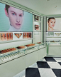 Photo by Prada Beauty on April 19, 2024. May be an image of 2 people, lipstick, makeup, fragrance, cosmetics, display case, perfume and text.