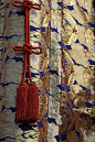 yuikki:<br/>Detail of float l stekler.  Buddhist knot on silk brocade patterned with dragons and clouds.<br/>