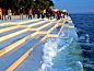 "Morske Orgulje" and or "The Sea Organ" Nikola Basic. Located on the shores of Zadar, Croatia, is the world’s first pipe organ which plays music by way of sea waves and 35 musically tuned polyethylene tubes located underneath a set of 