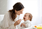 Photo of mother feeding baby baby eating healthy food