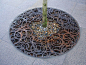 Tree grate at Aalborg City Center in Denmark by Frode Birk Nielsen