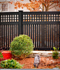 Gorgeous Black PVC Vinyl Semi-Privacy Fence with Old English Lattice and Three Inch Boards by Illusions Vinyl Fence. #fenceideas