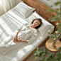 krockert9601_Asian_female_elderly_laying_on_her_side_on_a_woode_2b47022a-fb61-426a-bc9f-746468a2dd04