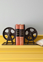 Film Industrial Bookends: Featuring a welded metal frame around a cast iron wheel - which could be inspired by an retro film reel or a backstage pulley / Modcloth@北坤人素材