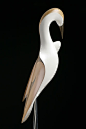 Kotuku • White Heron by Rex Homan, Māori artist (KR80307) : Medium: kauri, aluminum legs, rimu and painted fibre board MDF base. Size: 27 x 13 x 8 inches (H. 29 inches incl. base). Widespread in Australia, the South Pacific, Asia and Japan, the bird known
