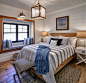 Inspiration for a mid-sized coastal guest medium tone wood floor, brown floor, shiplap ceiling and shiplap wall bedroom remodel in Other with white walls