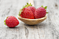 Strawberries in a wooden spoon by Paulo Gonçalves