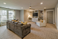 Inspiration for a mid-sized transitional enclosed carpeted home theater remodel in Nashville with gray walls and a media wall