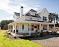 Example of a mid-sized country white two-story exterior home design in Portland with a hip roof and a shingle roof