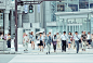 people crossing pedestrian lane near building at daytime