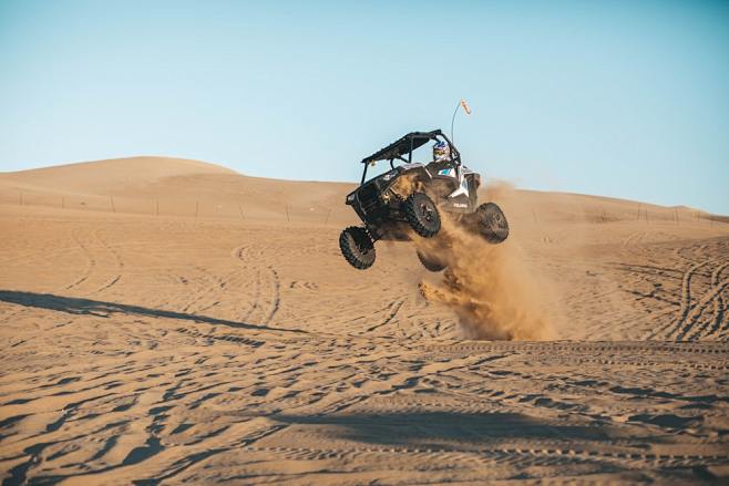 man riding on UTV on...