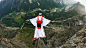 People 1920x1080 men sport  sports wingsuit basejumping jumping flying parachutes nature mountains helmet bird's eye view river trees forest field
