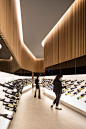 Bottle display. |  Feature lighting. |  Designed by local architect Arthur Casas it is a perfect example of how to make a boring, long space look magnificent. We like the bottle display system that shows each bottle label-up, and eliminates the need to ha