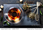 Tea composition with old spoon on dark background