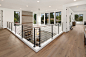 Inspiration for a large contemporary medium tone wood floor and gray floor hallway remodel in Seattle with white walls