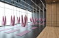 Ladies’ Fitness Center Interior Design 10 - Fitness area furnished to host air yoga exercises, the warm matte wood cladding covers the entrance and contrasted with black reflective flooring and ceiling creating a warm yet energized space in the ladies fit