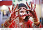 Desi Bride showing her henna hands wearing bangles on her wedding day