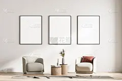 现代客厅内饰有两把扶手椅和小桌子。白墙上有三幅装裱海报。阅读和放松的概念。没有人。3 d渲染。