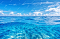 Photo blue sea ocean water surface and underwater with sunny and cloudy skyseascape summer background wallpaper
