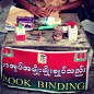 在仰光，第一次见到了专门装订书皮的营生，也算是缅甸人阅读热情的一个旁证吧。,oncemaybe