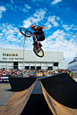 man riding bicycle above ramps during daytime