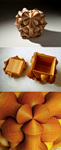 设计师Laszlo Tompa用樱桃木制作的储物盒，表面是CNC技术加工出来的复杂几何形状。