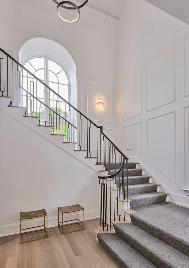 Inspiration for a large transitional carpeted u-shaped metal railing ...