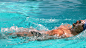 Premium stock video - Fit swimmer doing the back stroke in the swimming pool