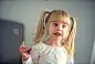 Cute little girl eating chocolate