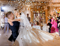 Free photo bride couple waving while dacning with confetti