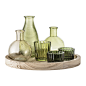 Buy Bloomingville Green Glass Votive Collection with Wooden Tray | Amara : Create a flickering display with this votive collection from Bloomingville. Containing six vessels, this set is perfect for a mix of tealight and taper candles to create an atmosph