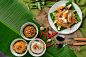 Papaya salad served with rice noodles and vegetable salad Decorated with Thai food ingredients.
