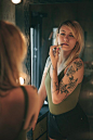Woman In Green Camisole Top Holding Lipstick