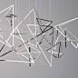 BANGLE A MODERN LIGHTING SCULPTURE, BANGLE OFFERS A STIMULATING FOCUS WITHIN ITS ENVIRONMENT Bangle is a precise assembly of scattered pyramidal forms. Discretely suspended lighting within the insta