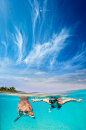 Magic Moments. : Shot at location, Riviera Maya, Mexico.Two cameras were used and shot almost at the same time to achieve the final image.Camera with housing for the underwater scene and a second camera for the surface scene with 3 off-camera flashes.Comm