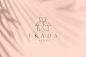 Brand identity for a clothing brand : В основу логотипа бренда детской одежды Ekada легло соединение образов платья и цветка. В рамках фирменного стиля разработаны логотип, паттерн, визитки, стикеры и упаковка.